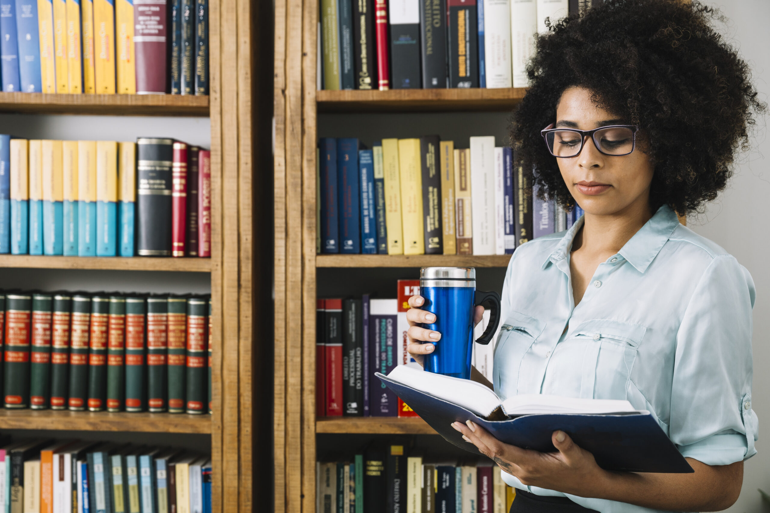 african-american-young-lady-with-thermos-book